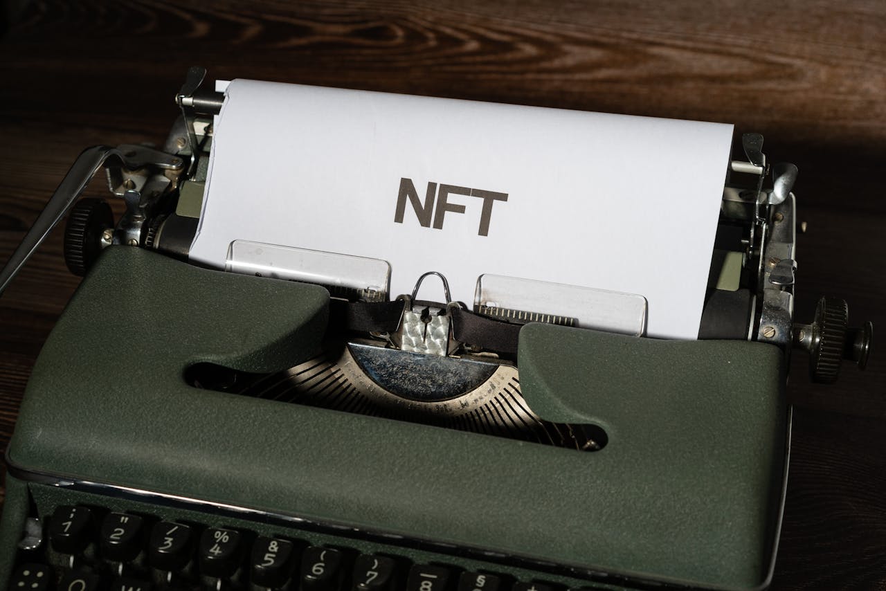 home-img Close-up of a vintage typewriter with the word 'NFT' typed on paper, symbolizing digital innovation.